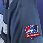 Product details of Custom Storm Blue Football Jersey showing stitched logos, fabric and customization options By Athletrio