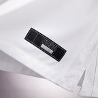 Product details tag of Custom Tennessee White Football Jersey showing stitched logos, fabric and customization options By Athletrio